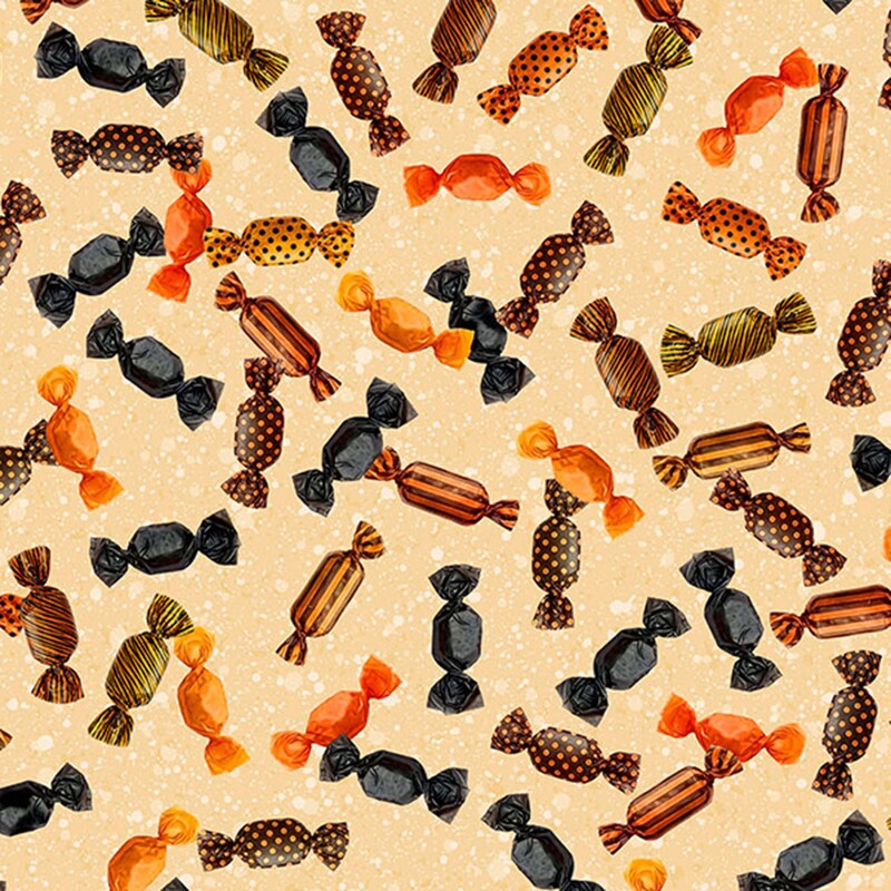 Warm tan fabric with tossed orange, brown, and black wrapped candies.