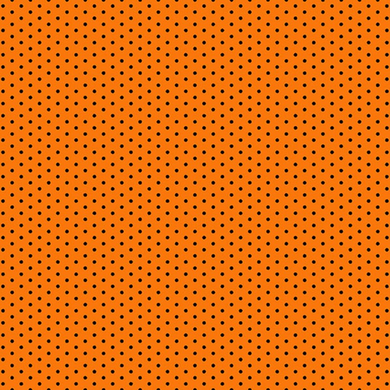 Bright pumpkin orange fabric with small black polka dots.