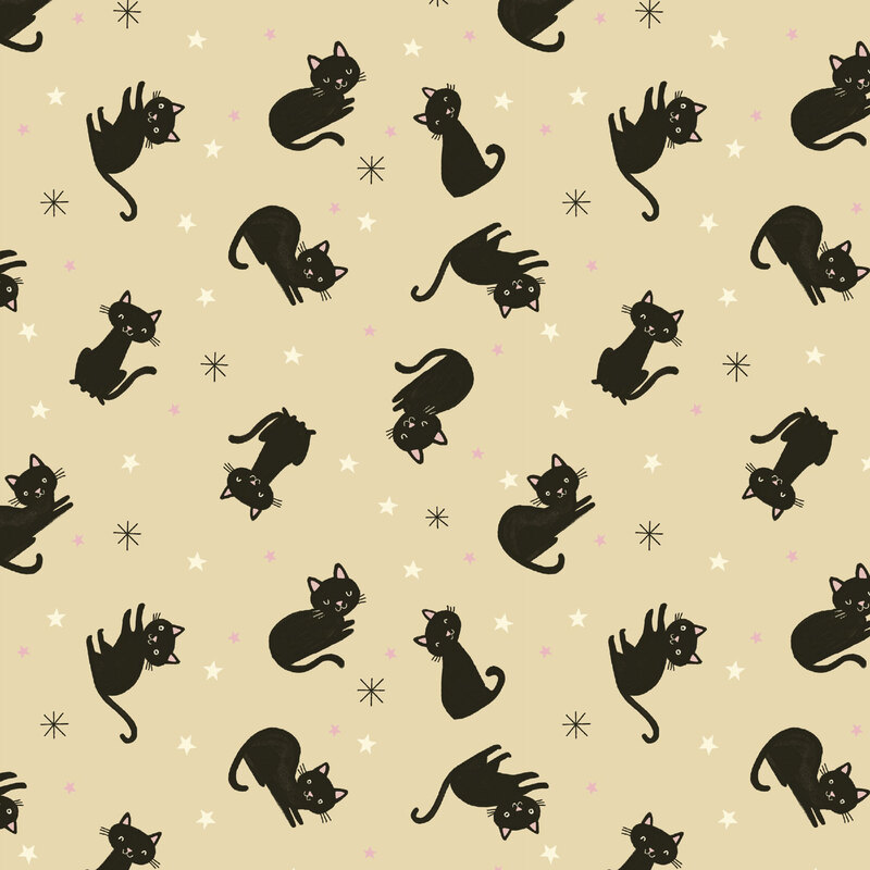 Tan fabric with a tossed pattern of black cats and multicolor stars.