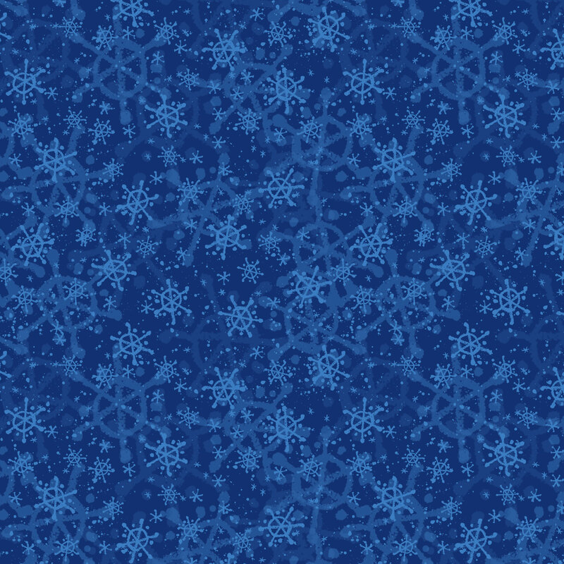 Navy blue fabric with a layered design of light blue snowflakes of varying shapes and sizes.