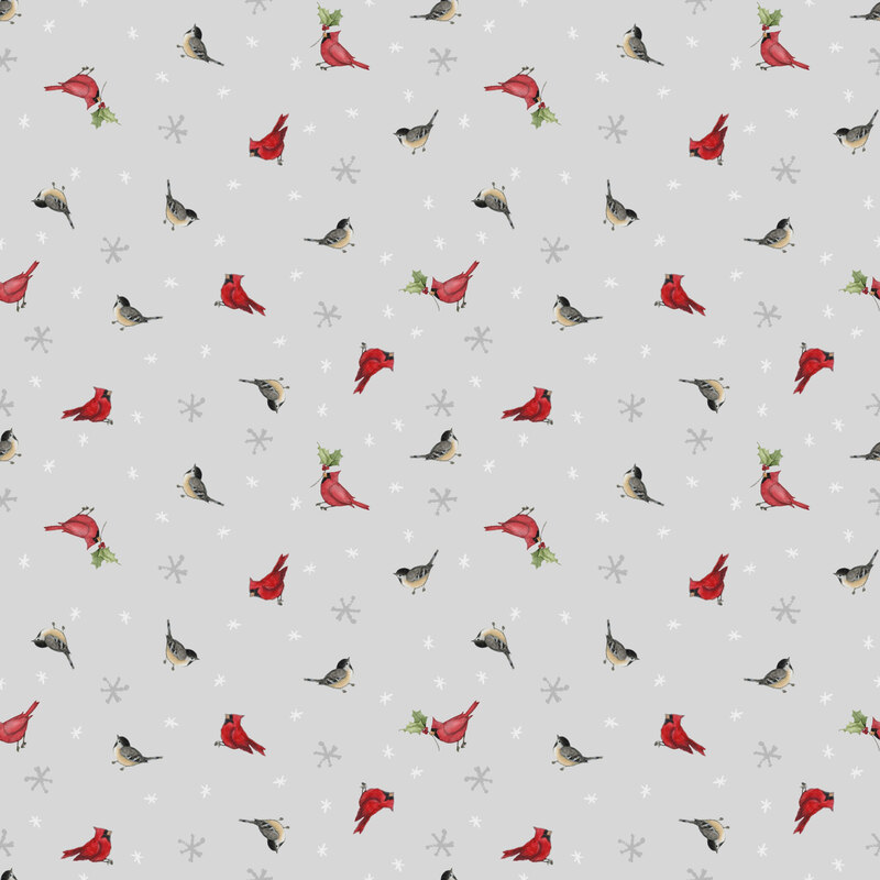 Smoke gray fabric with a tossed pattern of cardinals and snowflakes.