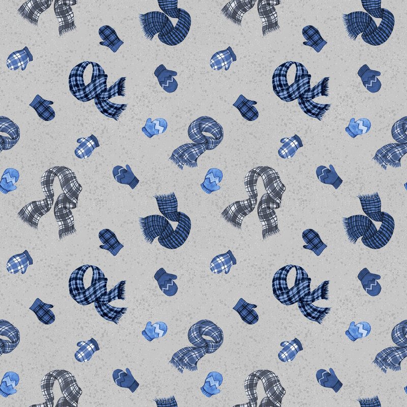 Gray fabric with a light dotted texture with a tossed pattern of blue mittens and scarves.