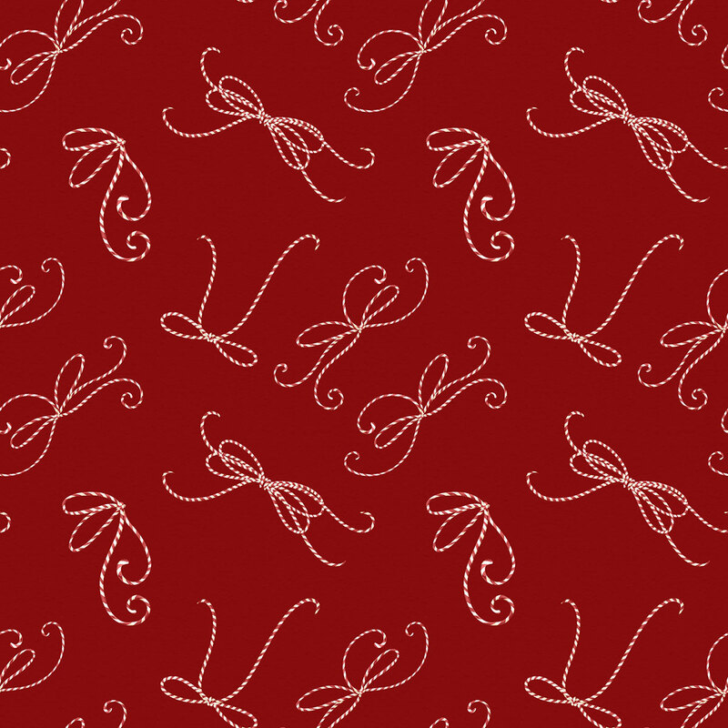 This deep red fabric features candy cane-striped twine tied into bows. 