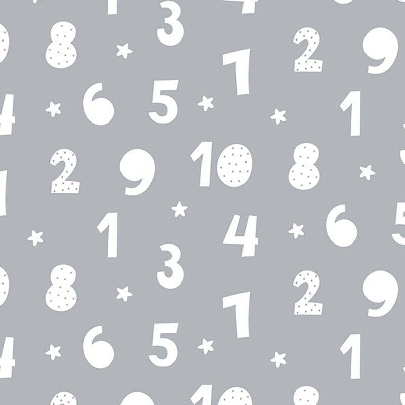 A gray fabric with scattered white numbers and small white stars.