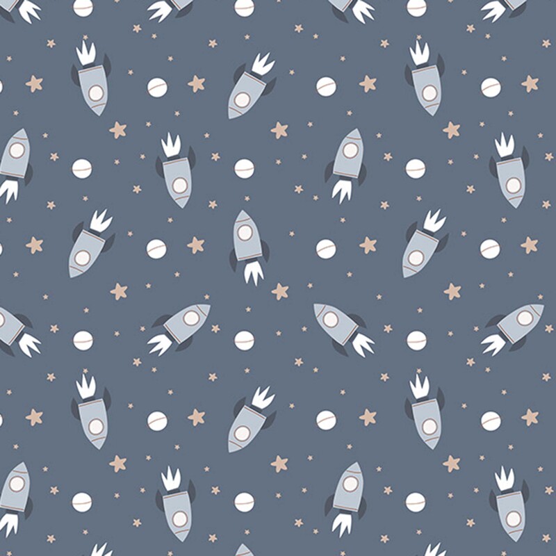 A denim blue fabric with scattered gray rockets, white exhaust flames, tan stars, and small ringed planets.