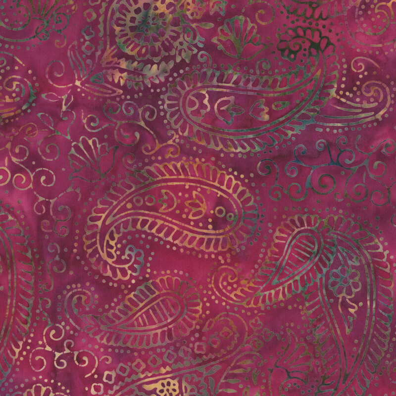 batik fabric featuring intricate paisley motifs, swirling vines, and delicate floral accents in shades of olive green, teal, and buff yellow against a richly mottled magenta and plum background.