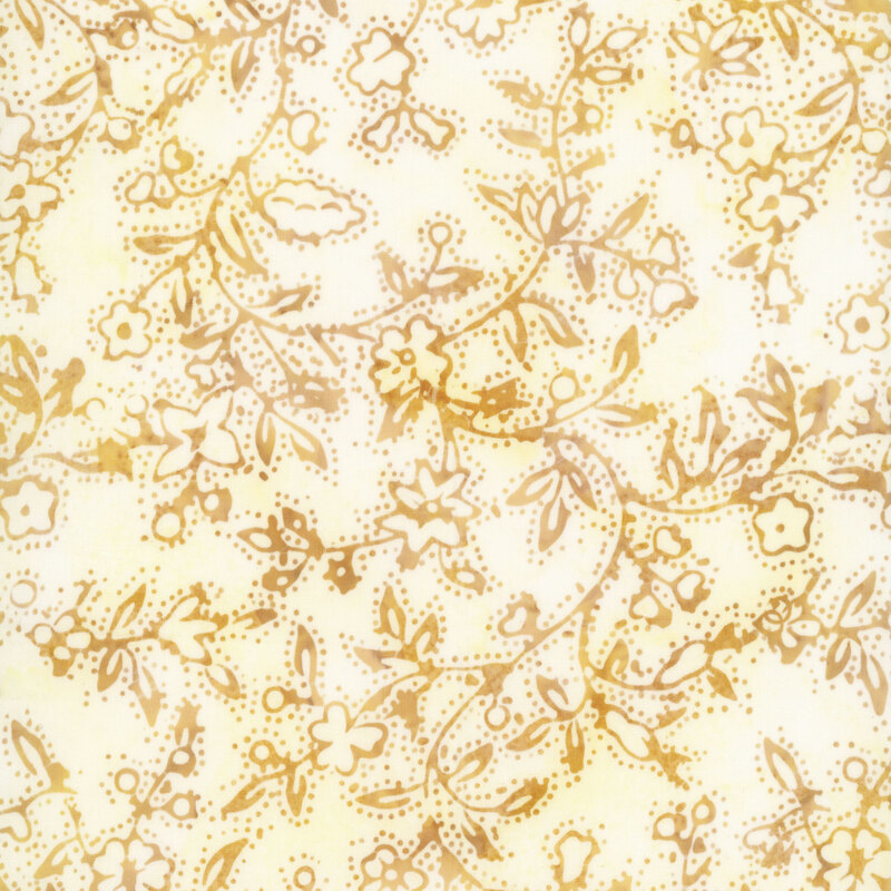 Dainty batik fabric featuring delicate, meandering floral vines with tiny blossoms, leaves, and dotted accents in warm golden shades against a mottled ivory and pale yellow background.