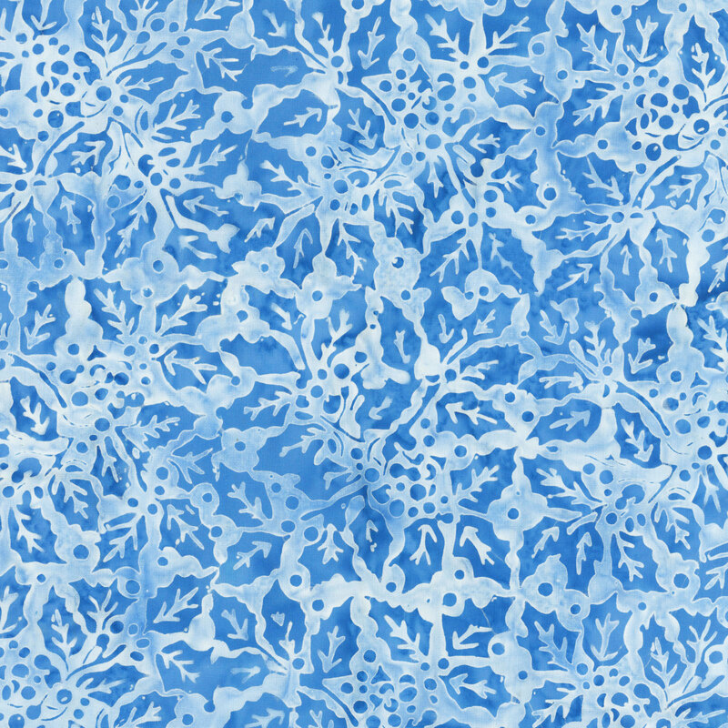 scattered holly leaves, berries, and delicate branches in tonal blue shades against a mottled pale blue background.