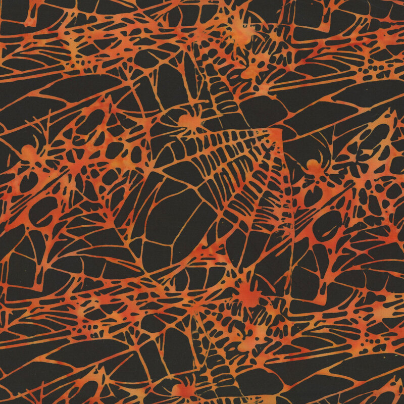 mottled orange-yellow spiderwebs with spiders on a black background.