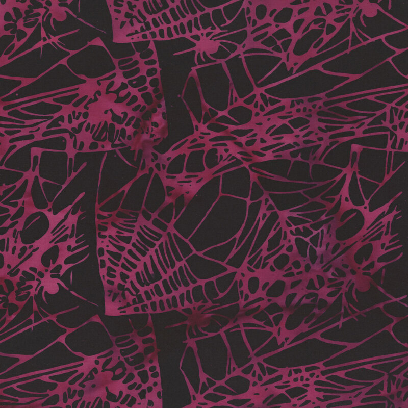 mottled magenta spiderwebs with spiders on a black background.