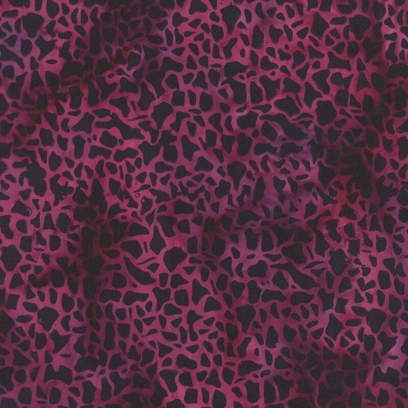 mottled magenta fabric featuring black abstract pebble shapes, creating a cracked texture look