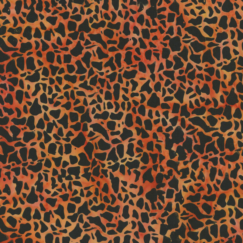 mottled orange fabric featuring abstract pebble shapes, creating a cracked texture look