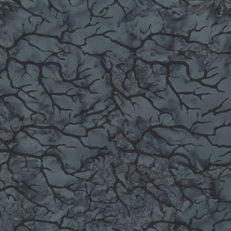 black tree branches scattered across a mottled charcoal grey background.