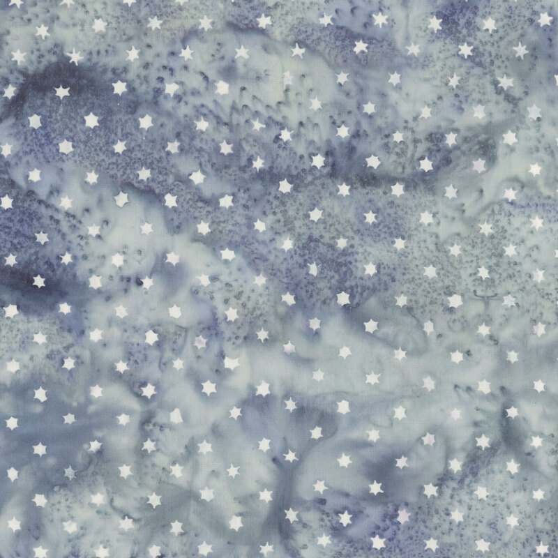 tiny stars scattered across a softly mottled background of icy blue and navy.