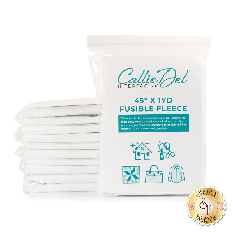 The Fusible Fleece - 45" x 1yd in its packaging, with a stack of five more packs behind the one in front, isolated on a white background. on a white background.on a white background.