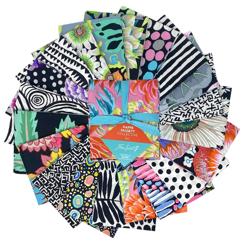 The Polaris Fat Quarter Bundle in its packaging, staged on top a circular arrangement of the included fabrics.