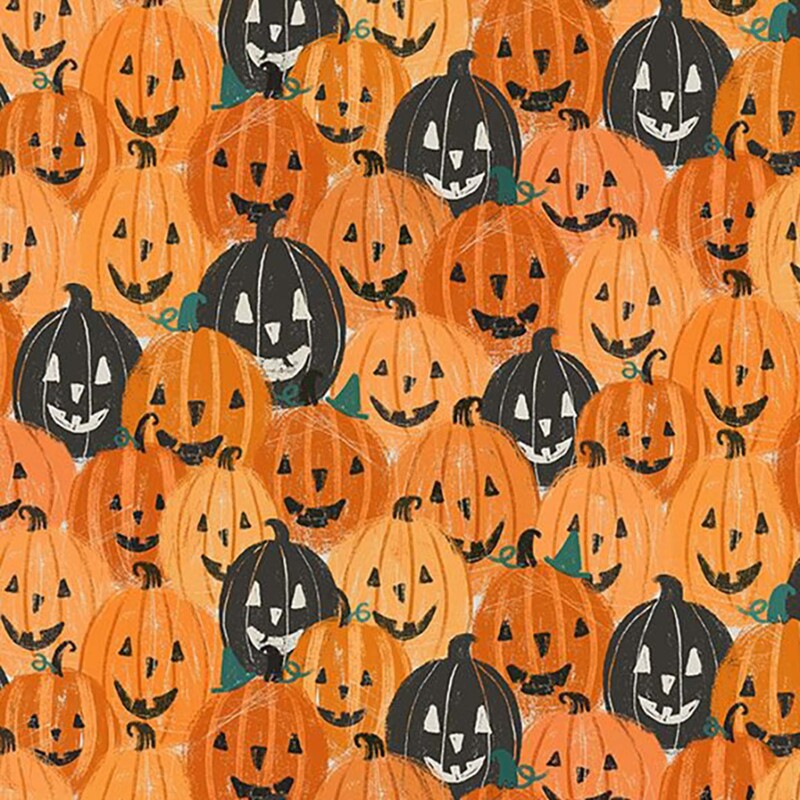 Orange fabric with a packed design of layered orange and black jack-o-lantern pumpkins.