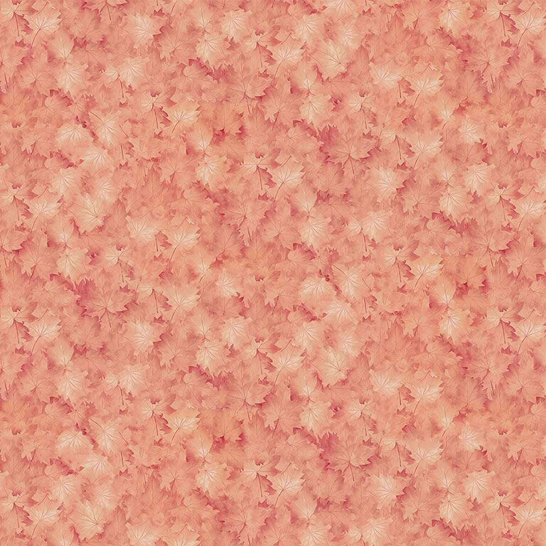 Tonal, autumnal fabric with a packed design of salmon pink maple leaves.