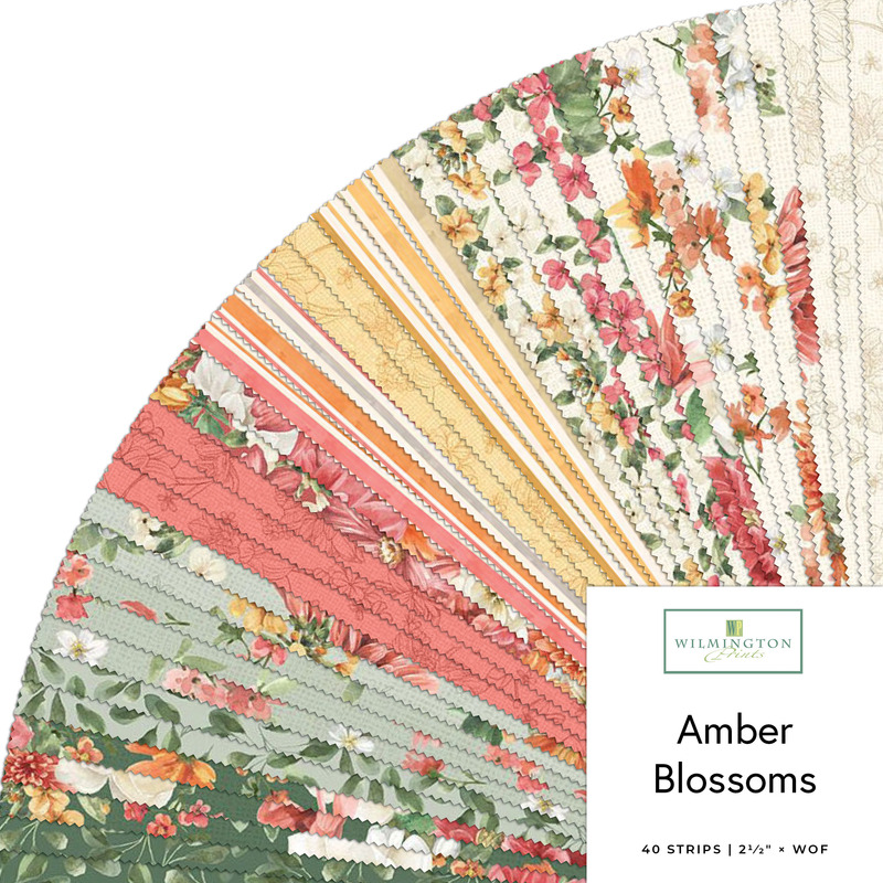 Fanned collage of floral fabrics from the Amber Blossoms collection.