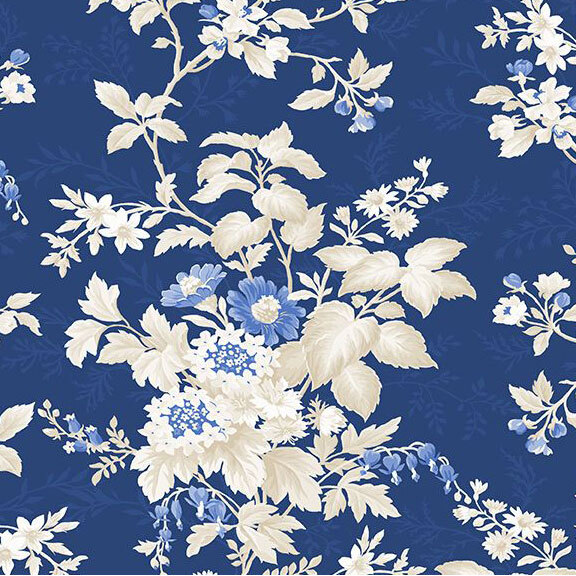 Dark blue fabric with blue and white florals and leaves.