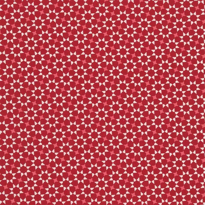repeating white and pink geometric star pattern on a red fabric.