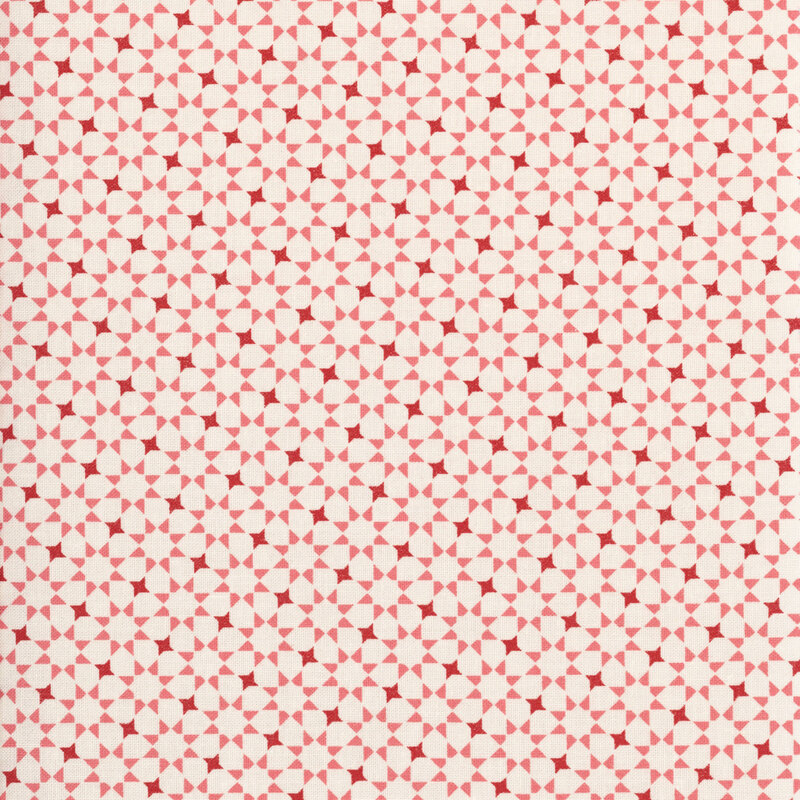repeating pink and red geometric star pattern on a cream fabric.