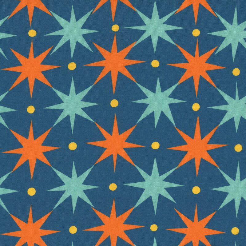 A denim blue fabric with ice blue and orange starbursts with yellow dots in between.