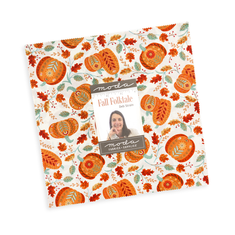 The Fall Folktale Layer Cake in its packaging, isolated on a white background. 