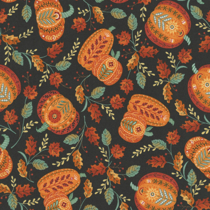 A black fabric with scattered folk art pumpkins containing intricate florals.