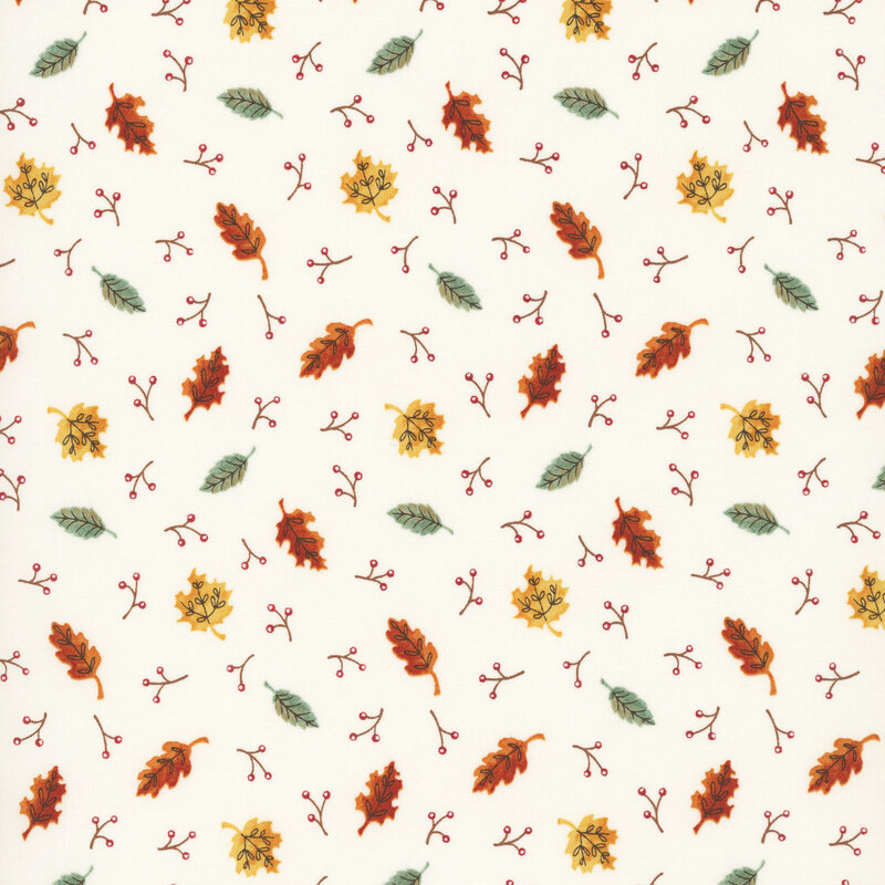 A white fabric with scattered fall leaves and berry sprigs.