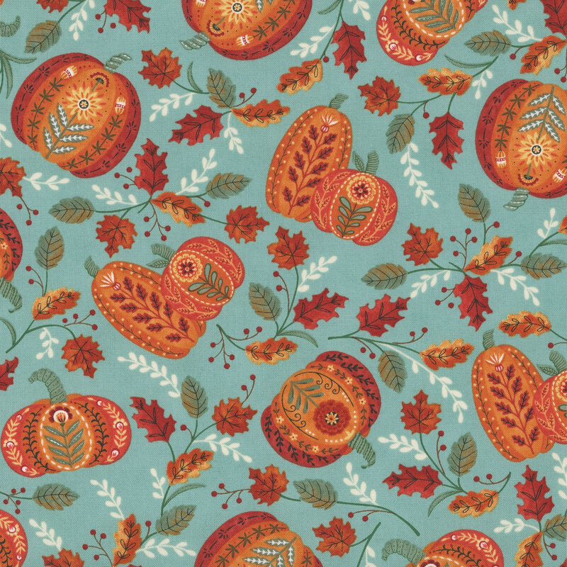 A pastel turquoise fabric with folk-art pumpkins and fall leaves.