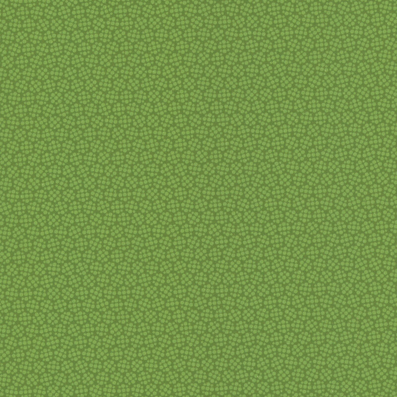 Grass green fabric with tonal, clustered dots.