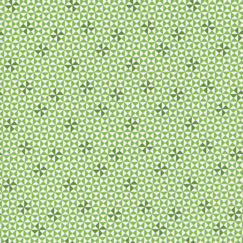 geometric pinwheel design in green and white hues.