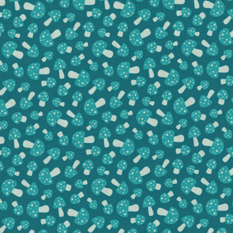 This cottage blue fabric features small scattered teal blue mushrooms.