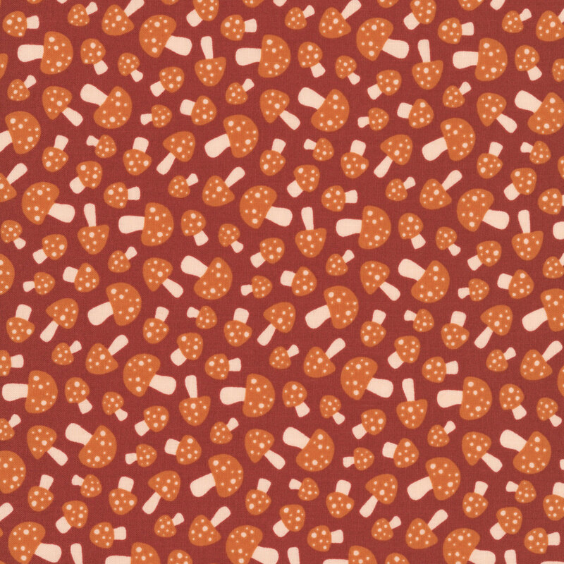 This terra cotta orange fabric features small scattered sienna mushrooms.