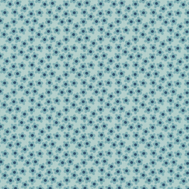 This vintage blue fabric features tossed blue flowers. 