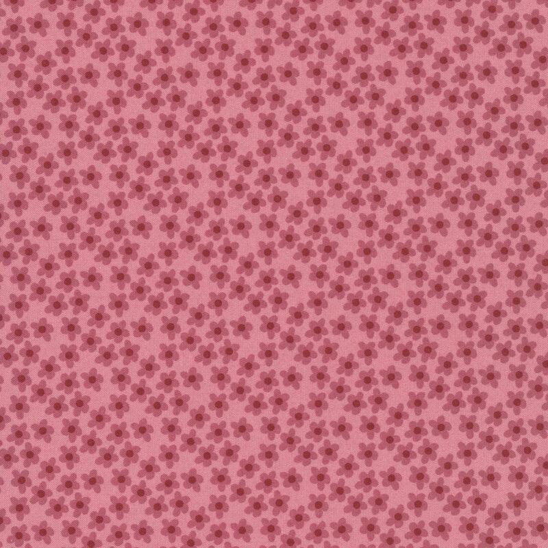 This tea rose pink fabric features tossed pink flowers. 