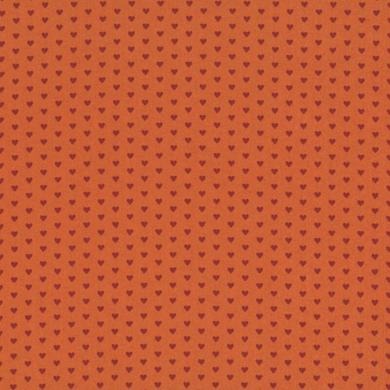 This sienna fabric features rows of tiny rusty red hearts. 