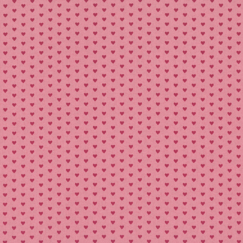 This pink fabric features rows of tiny dark pink hearts. 
