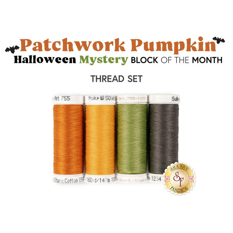 Four spools of orange, yellow, green, and gray thread isolated on a white background. 