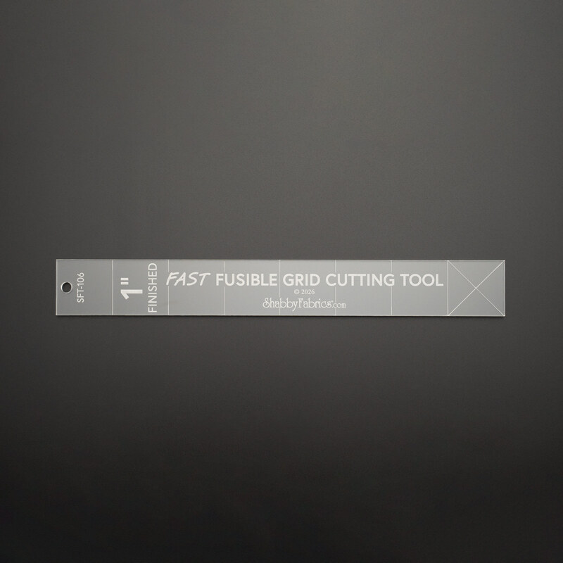The 1-inch finished size fast fusible grid cutting tool ruler on a black background.