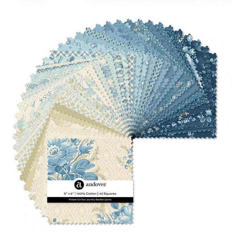 Sample of blue and cream floral quilting fabric squares fanned out.