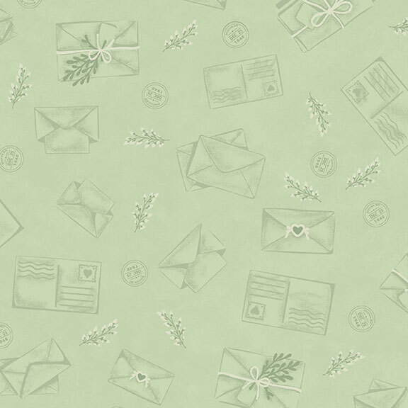 A pistachio green fabric with line-work envelopes and sprigs.