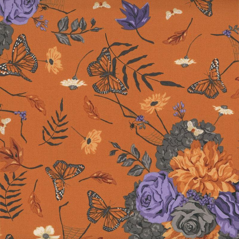 Pumpkin orange fabric with a scatter of floral bunches, spiders, spiderwebs, Monarch butterflies, moths, and falling leaves.