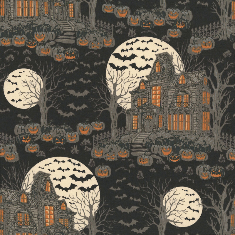 Black fabric with scenes of haunted houses and dead trees surrounded by jack-o'-lanterns and bats.