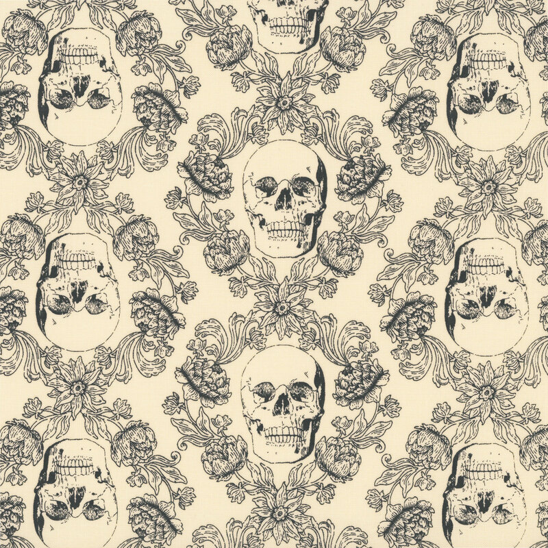 Cream fabric with a black ornamental design of floral vines surrounding skulls.