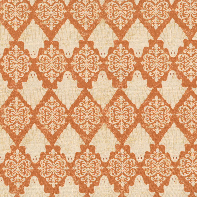 Textured pumpkin orange fabric with a damask pattern of alternating rows of cream colored ghosts and ornamental motifs.