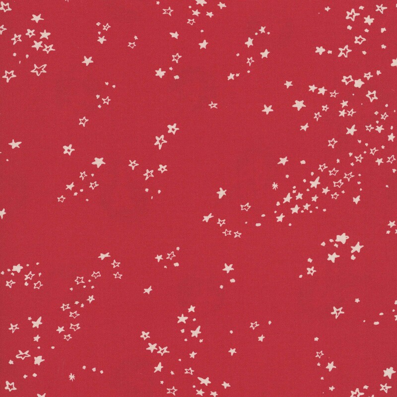 Christmas red fabric with a scattering of cream stars in various styles.