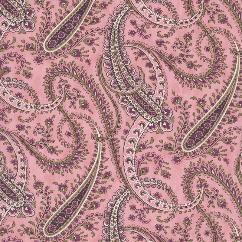 Pink fabric with a swirling pattern of paisley designs and abstract florals.