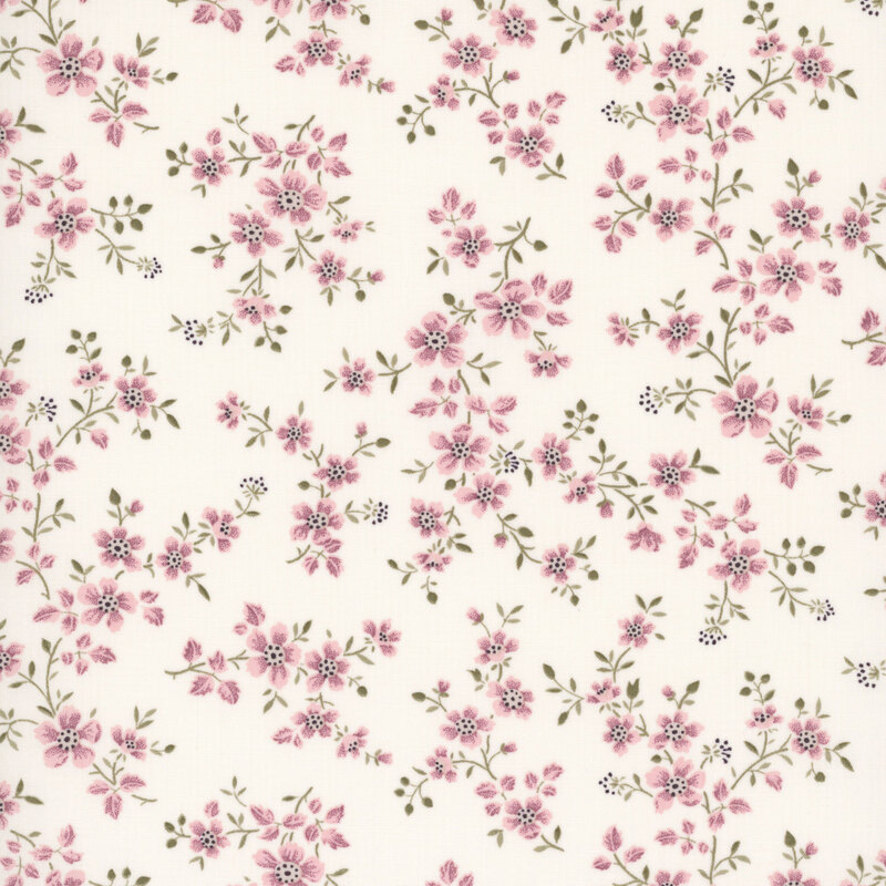 White fabric with a pattern of florals entwined with leafy vines.
